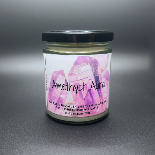 Front view of Amethyst Aura candle, crystal design label, dark lid.