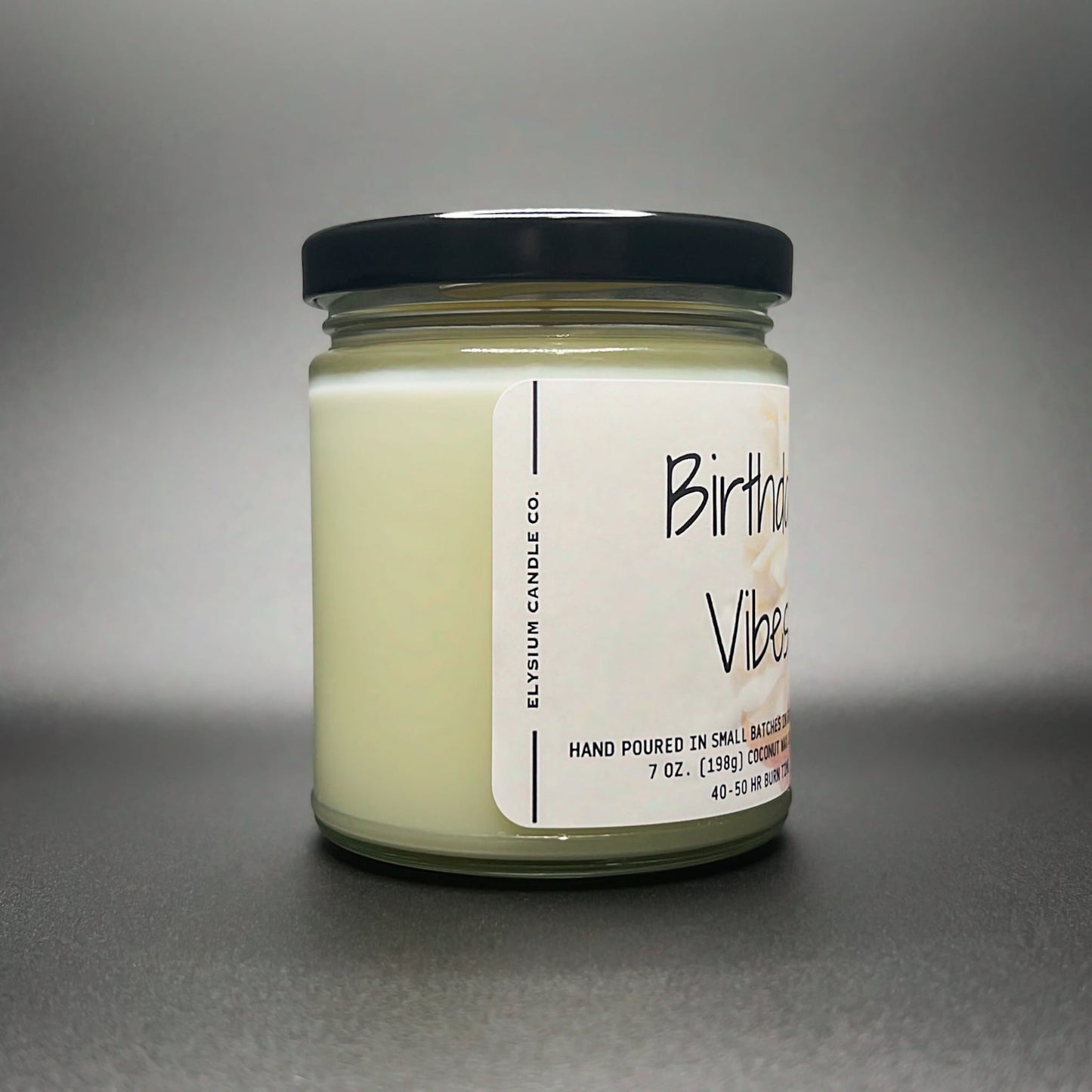 Side view of the Birthday Vibes candle, showcasing the pure and natural coconut soy wax blend in Elysium Candle Co.’s signature 7 oz jar.