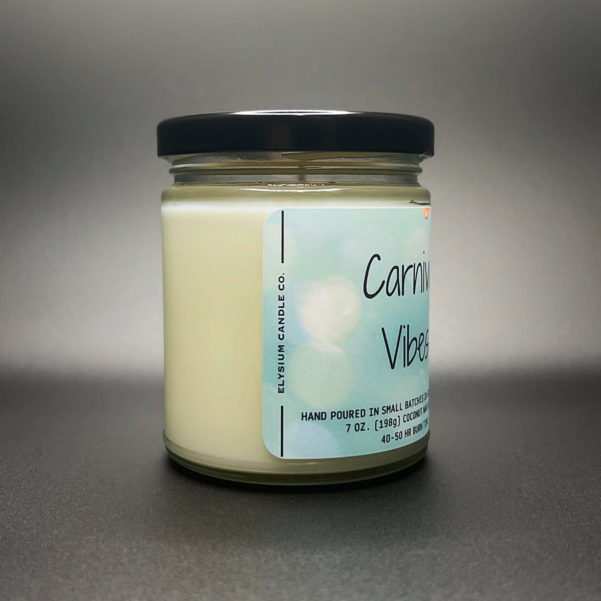 Carnival Vibes coconut soy blend wax candle in glass jar with label.