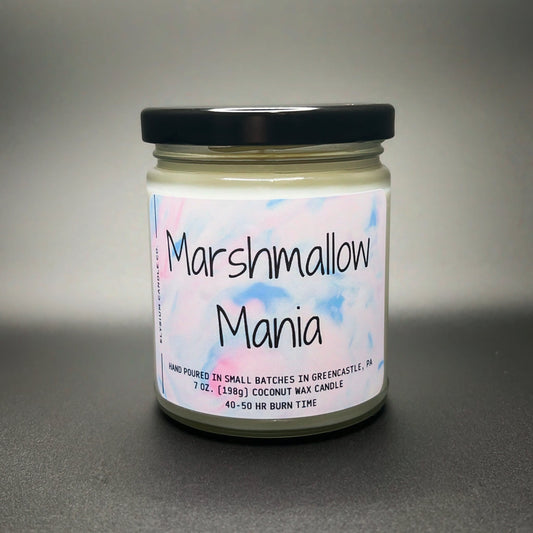 A jar candle labeled ‘Marshmallow Mania’ by Elysium Candle Co., showcasing a pastel watercolor label, indicating it’s hand-poured in small batches with coconut soy wax blend, with a 40-50 hour burn time.